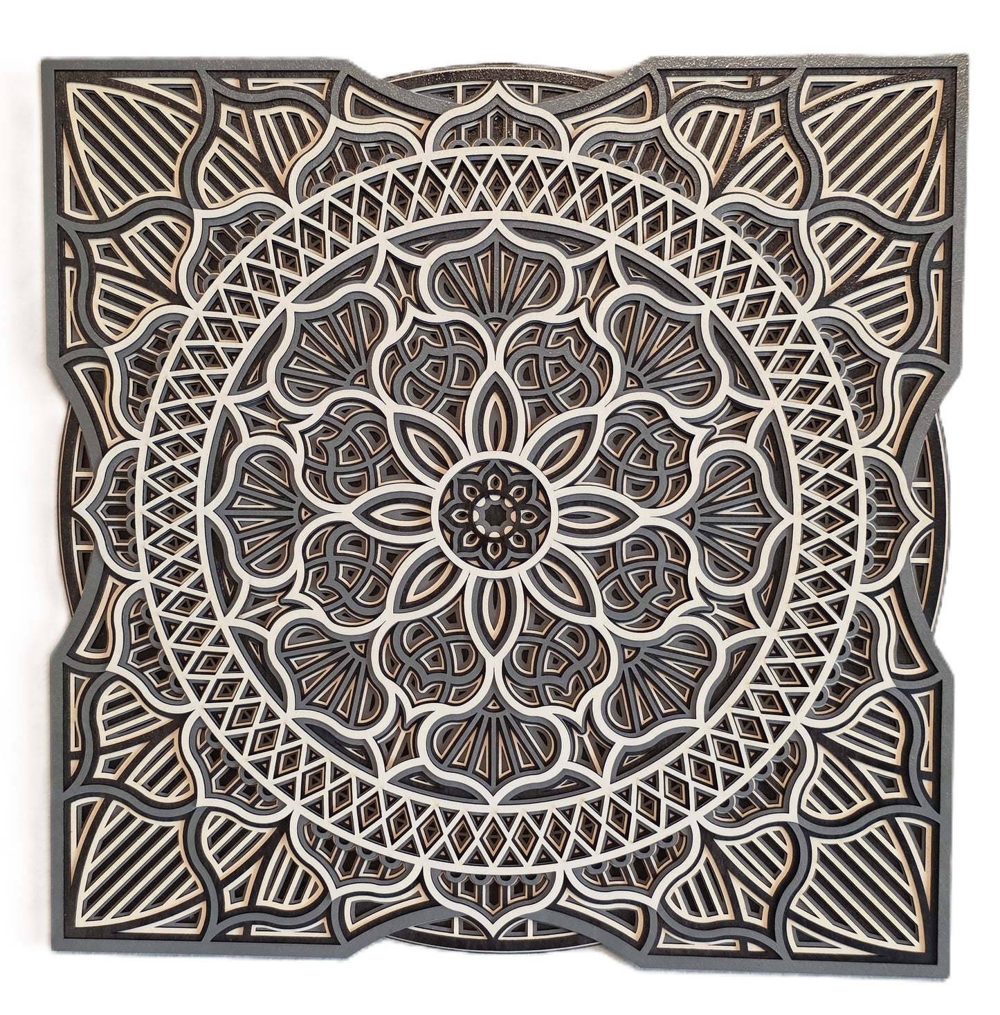 Sacred Bloom Mandala wall art with floral and geometric patterns in multiple layers, framed in square design.